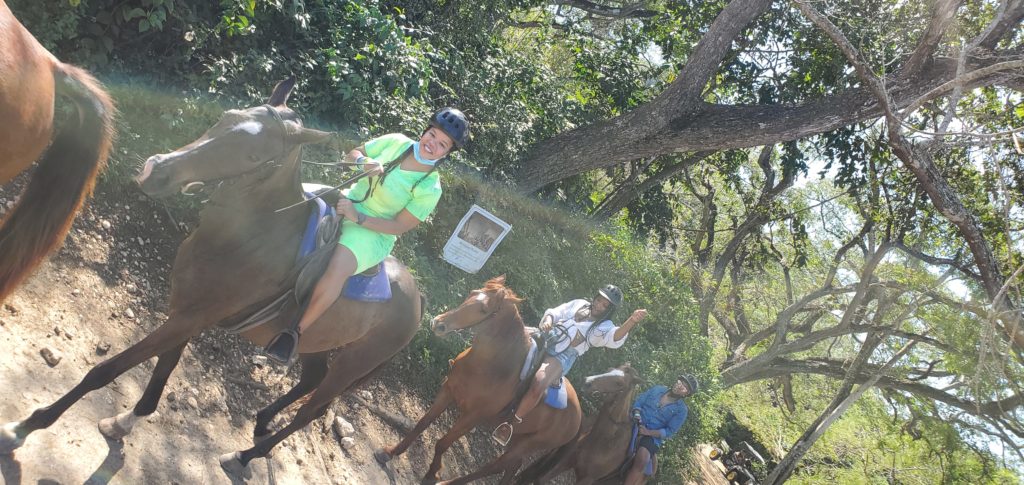 Black women riding horses with helmets on in Montego Bay Jamaica